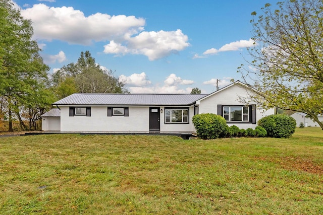 single story home featuring a front lawn