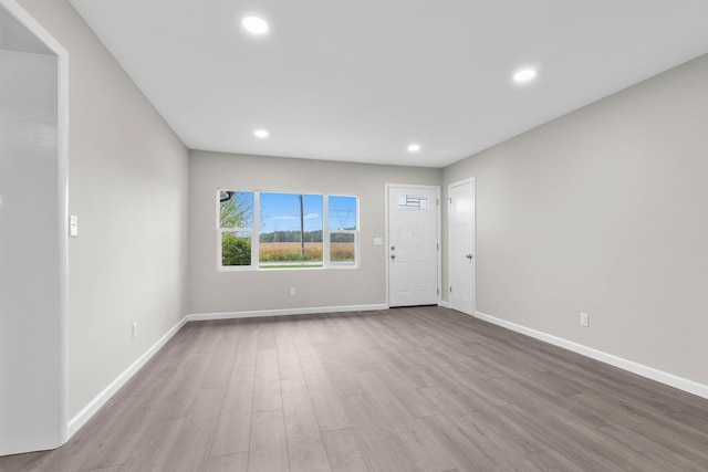 foyer entrance with light hardwood / wood-style floors