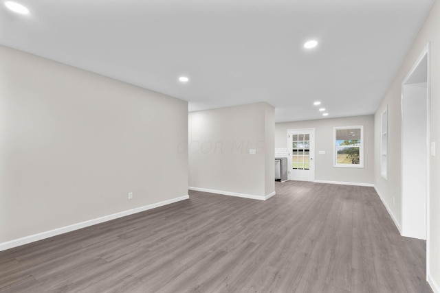 unfurnished living room featuring hardwood / wood-style flooring