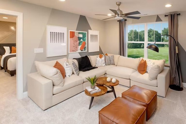 carpeted living area with recessed lighting and ceiling fan