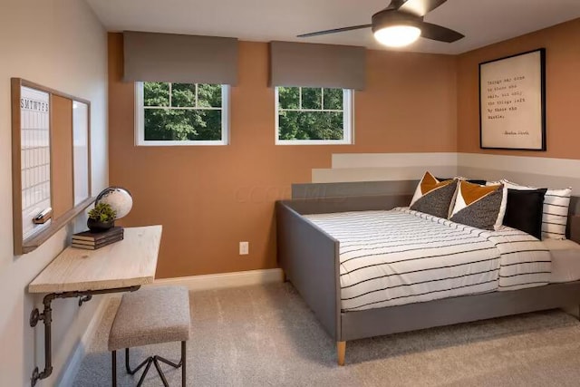 carpeted bedroom featuring baseboards