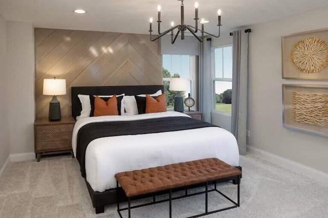 bedroom featuring a notable chandelier, baseboards, wood walls, and light carpet