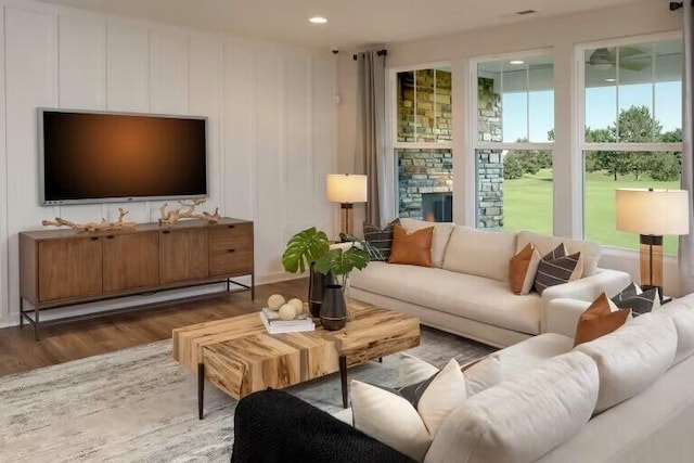 living room with recessed lighting and wood finished floors