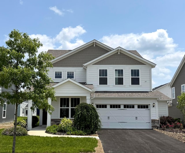 8768 Apricot Way Lot 1918, Plain City, OH 43064 - craftsman-style home with asphalt driveway, stone siding, a garage, and a shingled roof