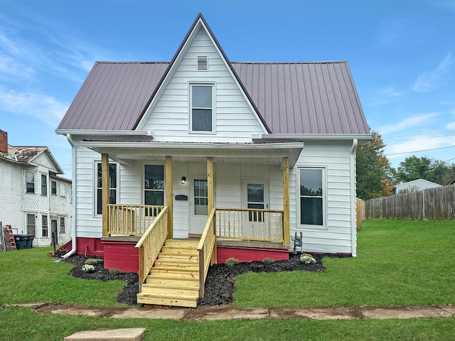 bungalow-style home with covered porch and a front lawn