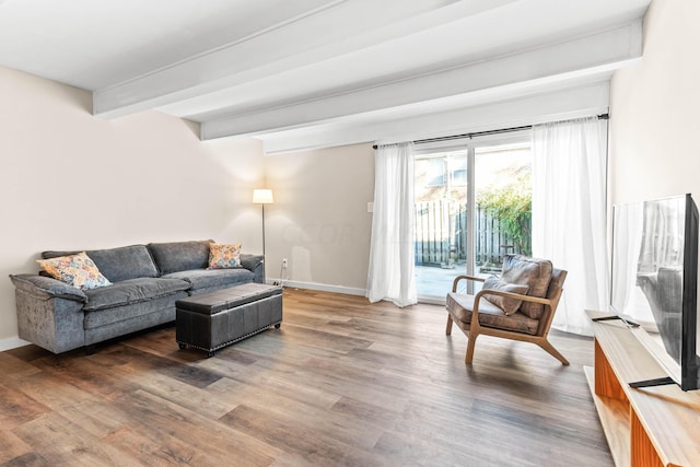 living room with beam ceiling and hardwood / wood-style flooring