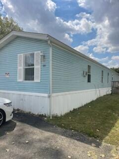 view of home's exterior featuring a lawn