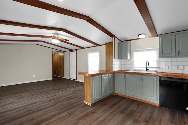 kitchen featuring black dishwasher, lofted ceiling with beams, a healthy amount of sunlight, and sink