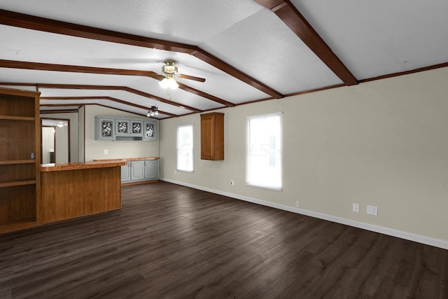 unfurnished living room featuring a textured ceiling, ceiling fan, lofted ceiling with beams, and dark hardwood / wood-style floors