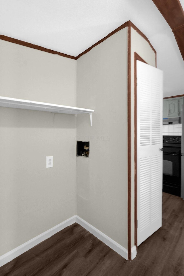 laundry area featuring crown molding, washer hookup, and dark hardwood / wood-style floors