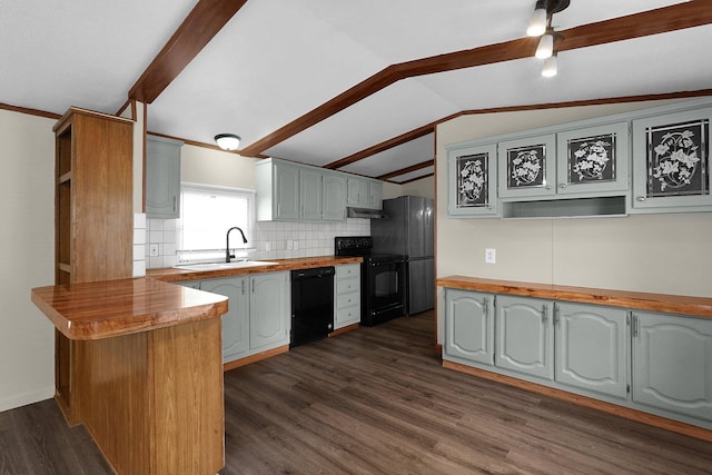 kitchen with black appliances, lofted ceiling with beams, kitchen peninsula, and dark wood-type flooring