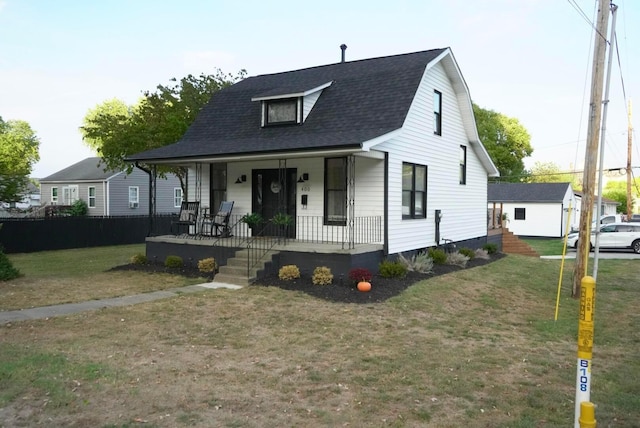 view of front of home featuring a front lawn and covered porch