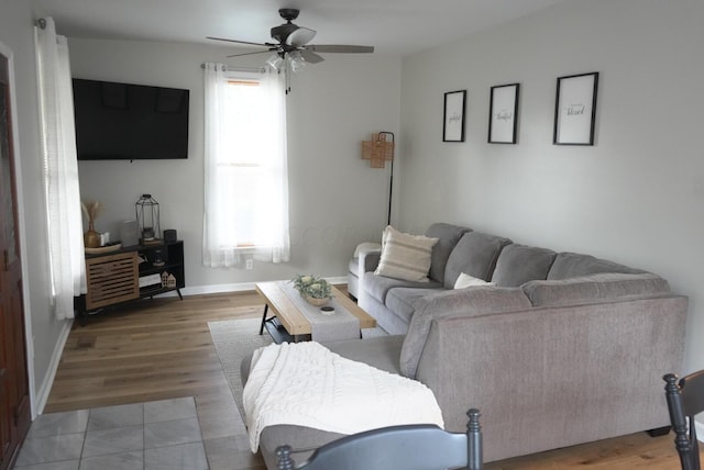 living room featuring hardwood / wood-style flooring and ceiling fan