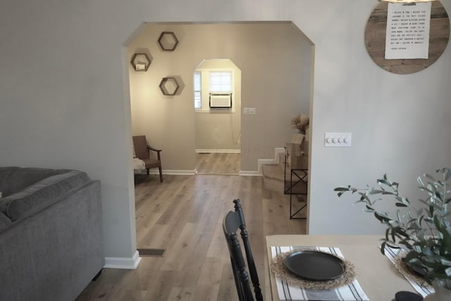 dining space featuring light hardwood / wood-style flooring and cooling unit