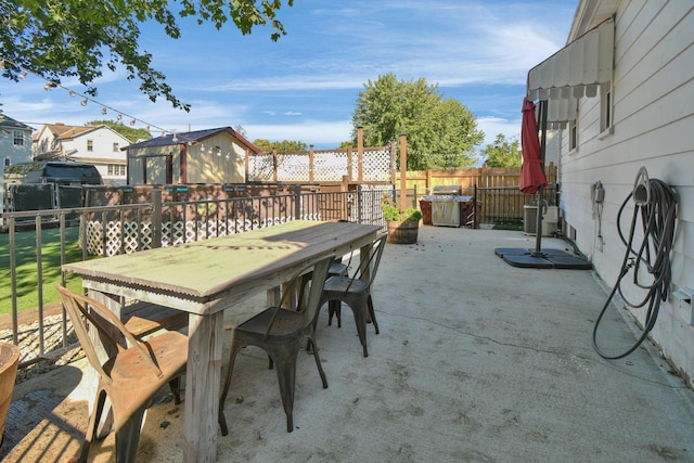 view of patio / terrace with a grill and cooling unit