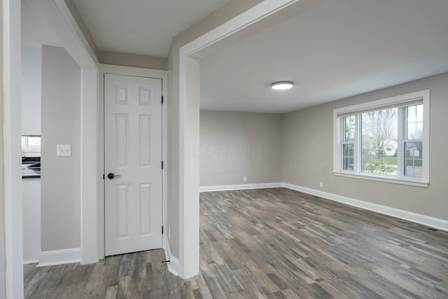 unfurnished room featuring dark hardwood / wood-style floors