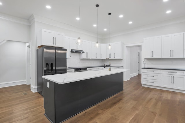 1571 Dyer Rd, Grove City, OH 43123 - kitchen featuring stainless steel fridge, decorative backsplash, crown molding, white cabinetry, and light stone counters