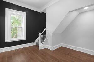 1571 Dyer Rd, Grove City, OH 43123 - additional living space with wood finished floors and stairway