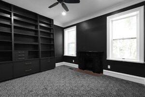 1571 Dyer Rd, Grove City, OH 43123 - unfurnished living room featuring plenty of natural light, ceiling fan, and crown molding