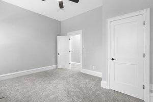1571 Dyer Rd, Grove City, OH 43123 - unfurnished bedroom with baseboards and a ceiling fan