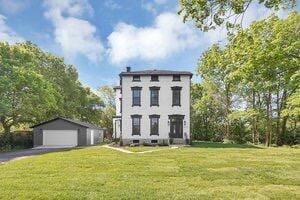 1571 Dyer Rd, Grove City, OH 43123 - italianate-style house featuring an outbuilding, a detached garage, and a front lawn