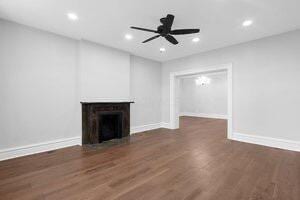 1571 Dyer Rd, Grove City, OH 43123 - unfurnished living room featuring a fireplace, wood finished floors, a ceiling fan, and recessed lighting