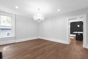 1571 Dyer Rd, Grove City, OH 43123 - unfurnished dining area with a chandelier, dark wood-style flooring, and recessed lighting