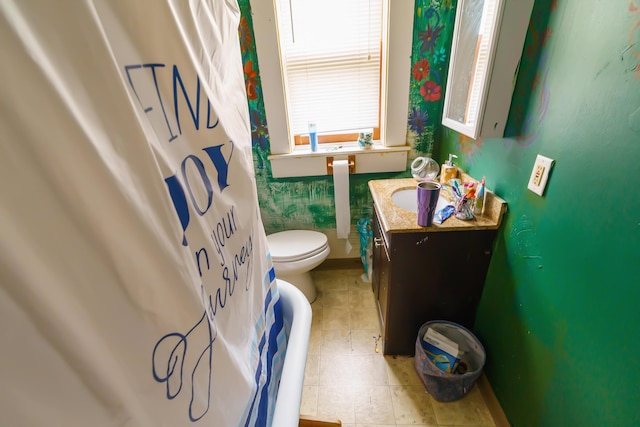 bathroom featuring vanity and toilet