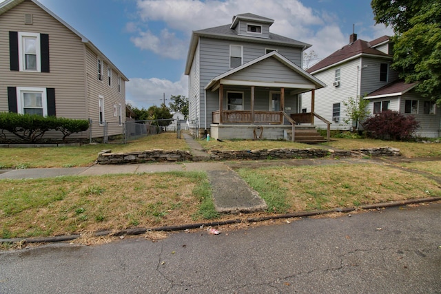 view of front facade with a front yard and a porch