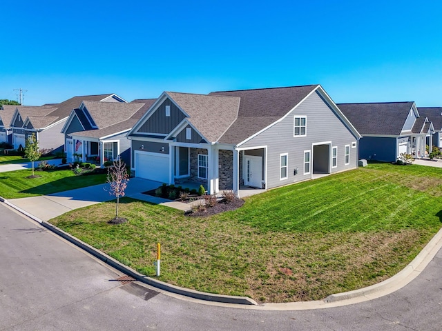 view of front of home with a garage and a front lawn