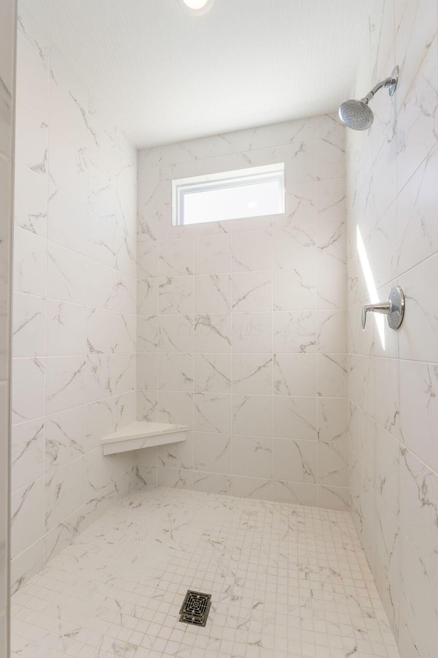 bathroom featuring tiled shower