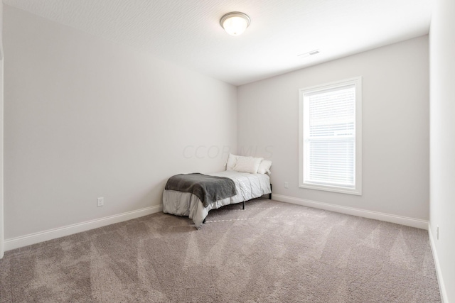 unfurnished bedroom featuring carpet flooring