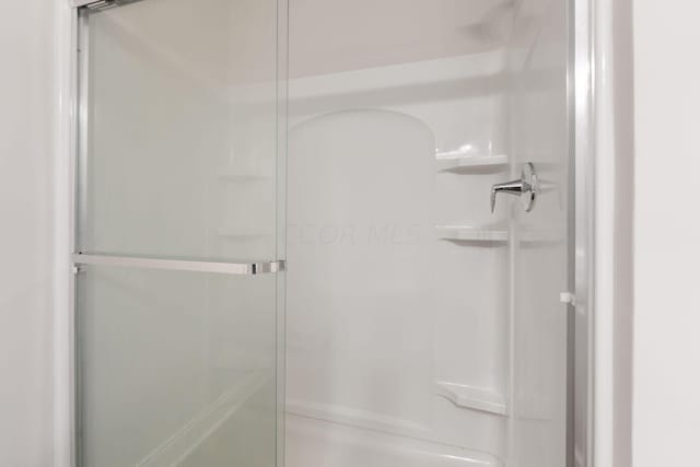 bathroom featuring walk in shower