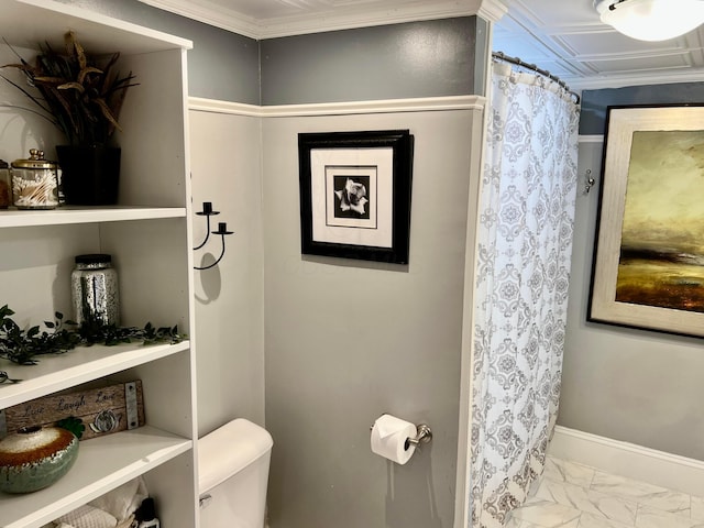 bathroom featuring toilet and ornamental molding