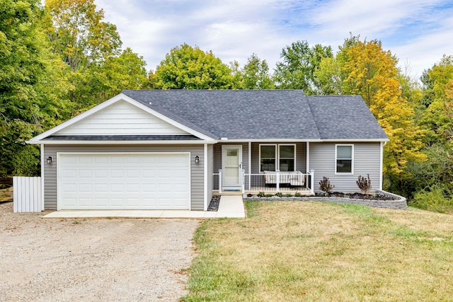 ranch-style home featuring a porch, a garage, and a front lawn