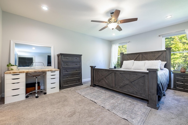 carpeted bedroom featuring ceiling fan