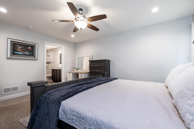 bedroom with ceiling fan, carpet, and ensuite bathroom