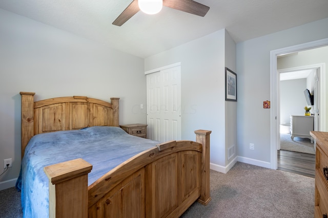 carpeted bedroom with a closet and ceiling fan