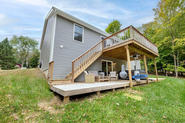 back of house featuring a lawn, an outdoor hangout area, and a deck