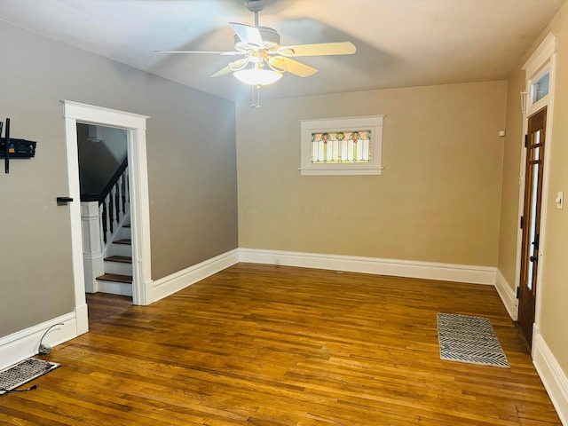 interior space featuring wood-type flooring and ceiling fan