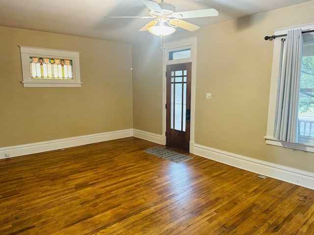 foyer featuring dark hardwood / wood-style flooring and ceiling fan