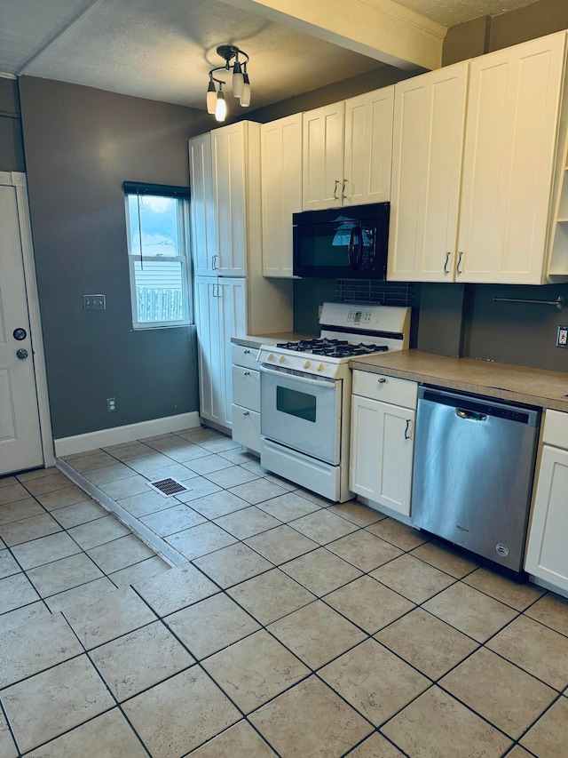 kitchen featuring a textured ceiling, white cabinetry, stainless steel dishwasher, and gas range gas stove