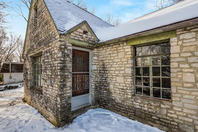 view of snow covered property entrance