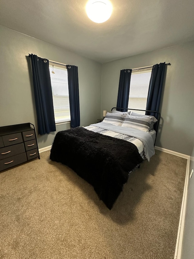 bedroom with light colored carpet