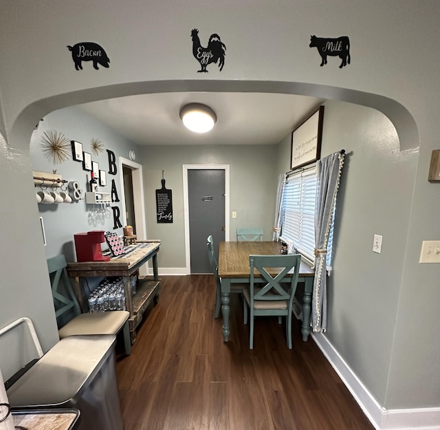 dining room with dark wood-type flooring