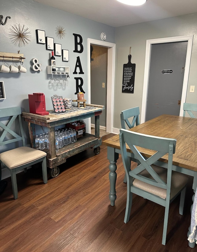 dining space with hardwood / wood-style flooring