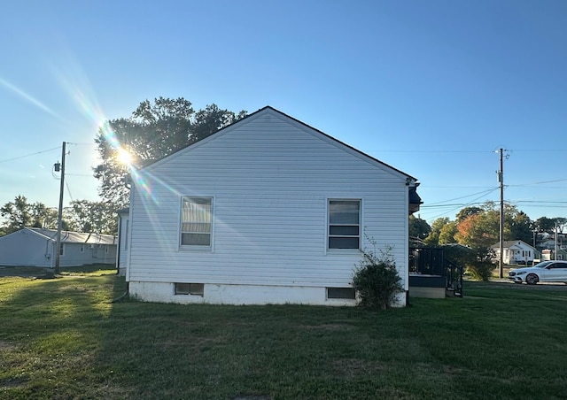 view of property exterior with a yard