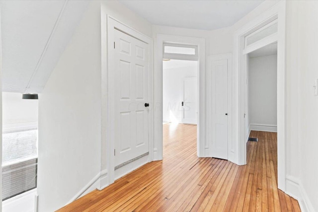 hallway featuring hardwood / wood-style floors