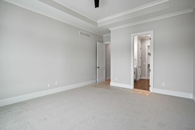 unfurnished bedroom featuring carpet, ceiling fan, and crown molding