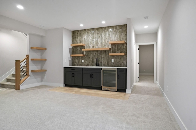 bar featuring wine cooler, wooden walls, and light colored carpet